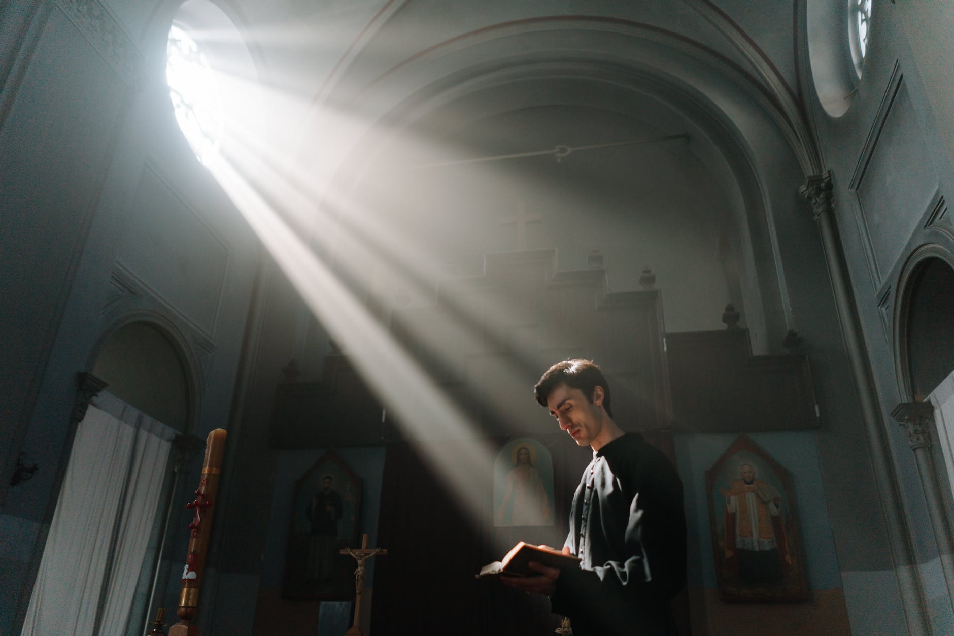 a priest reading bible